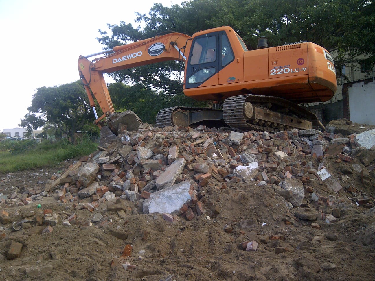 Harry's Demolishers performing a site demolition